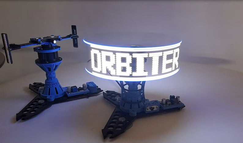 The Orbiter LED Display Stand projects floating text and patterns with dynamic rotation—stylish, futuristic, and unforgettable.